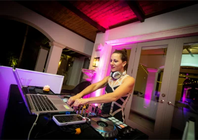 Female DJ on the turntable at a party.